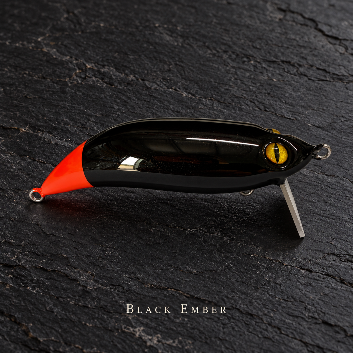 PhD Frog Fish WAKE lure in Black Ember on black slate