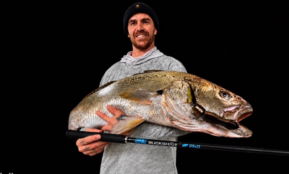 Angler holding a large Mulloway
